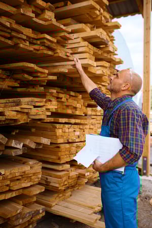 carpenter-uniform-check-boards-sawmill